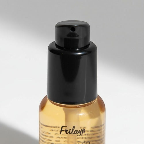 Serum reparador Distriwil Frilayp con aceite de coco y argán en envase de 50cc con válvula dosificadora negra