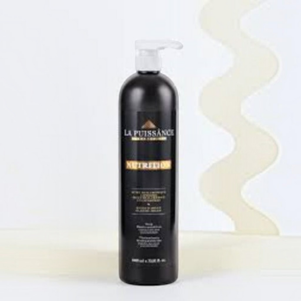 Botella de shampoo La Puissance con aceite de argán de 1000 ml en envase negro con dosificador, vendido por Distriwil